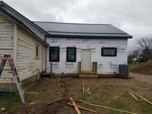 Home renovation with new addition and door installed.